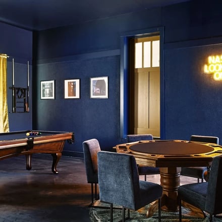 Game room with pool and poker tables at Rocktop Nashville