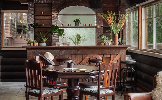 Cocktail lounge with poker table and wet bar at Rocktop Nashville